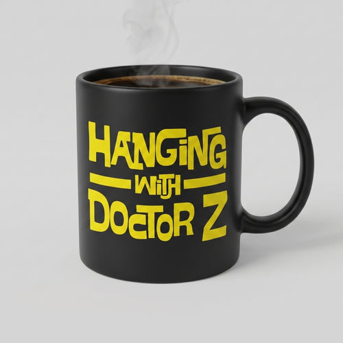 Black mug with yellow text 'Hanging with Doctor Z' on a white background