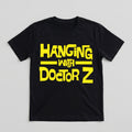 Black t-shirt with yellow text 'Hanging with Doctor Z' on a light gray background