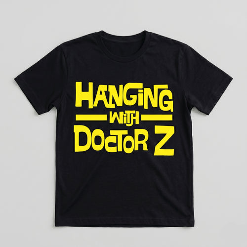Black t-shirt with yellow text 'Hanging with Doctor Z' on a light gray background